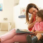 Girl and mother reading a fairy tale