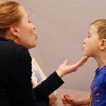 Speech therapist works with a child