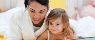 Mom and daughter looking at a book